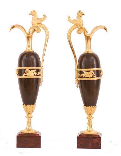 A pair of French Empire ormolu and bronze decorative ewers, circa 1800.